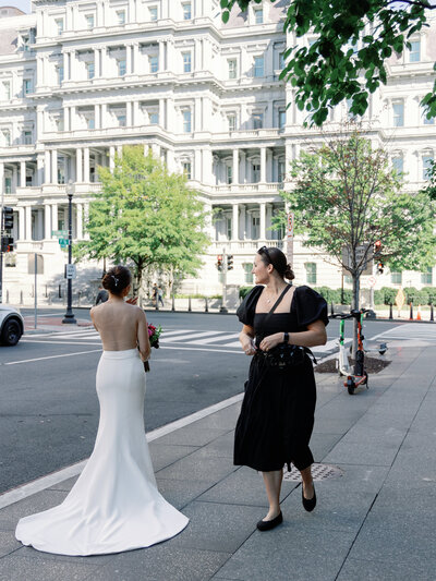 Bride stands outside of the St. Regis Hotel in Washington, D.C. for portraits