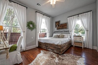 Peaceful bedroom in this 2-bedroom 2-bathroom vacation rental home on the Baylor University campus in Waco, TX