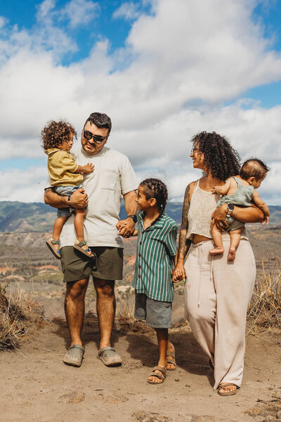 Candid family adventure session overlooking the mountains of Kauai — storytelling Hawaii family photography by Leslie Carbajal.