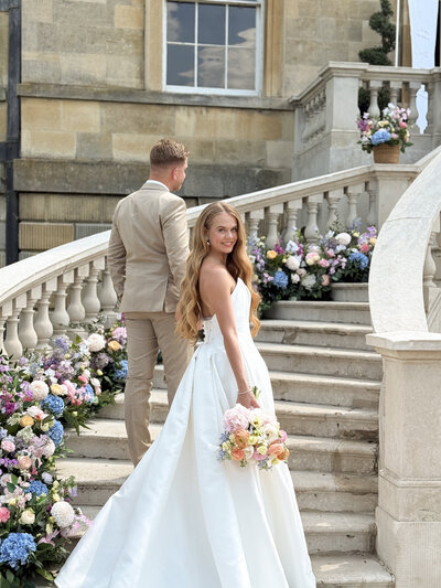 Bride and groom walking hand in hand, filmed candidly for social media content