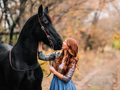 girl in prom dress with palomino horse
