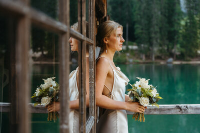 Bride at Lago di Braies boat house