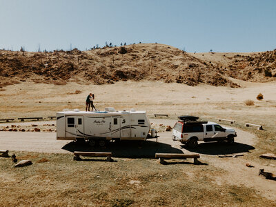 Truck pulling a camper in the desert