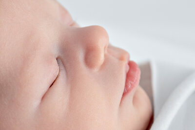 A closeup profile of a sleeping newborn baby in Huntsville Alabama