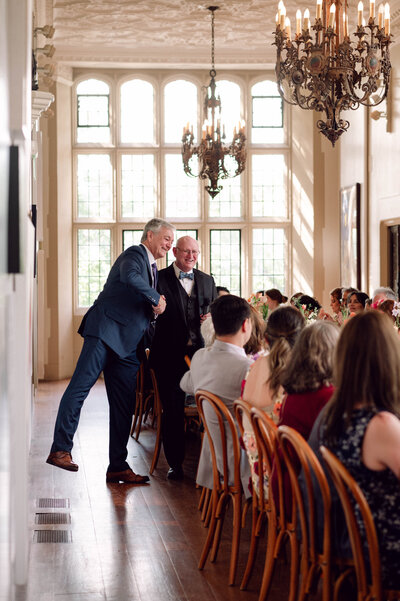 Kellen and Paul sharing a toast during their wedding reception in New York City.