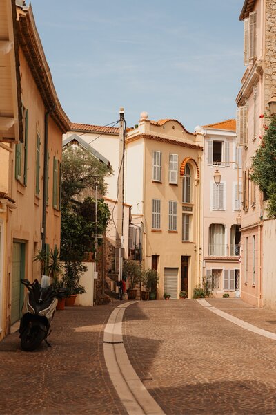 Quiet European village street representing individual interpretation of travel oasis. Tailored Oasis Travel Co.