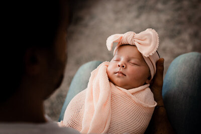 Dad holding baby for newborn photography in oshawa