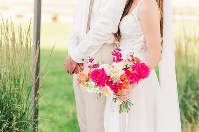wedding portrait of bride and groom standing still close up of the bride's bouquet at an idaho wedding at the barn at mader farm in genesee idaho