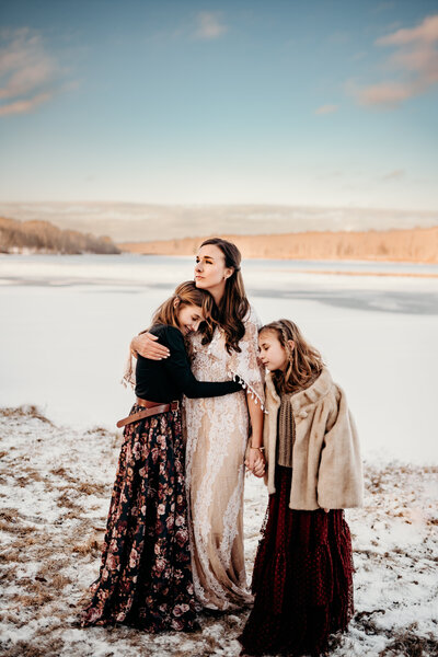 motherhood image with mom and two girls