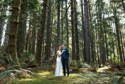 Happy elopement couple with Mount Rainier and a forest as a backdrop