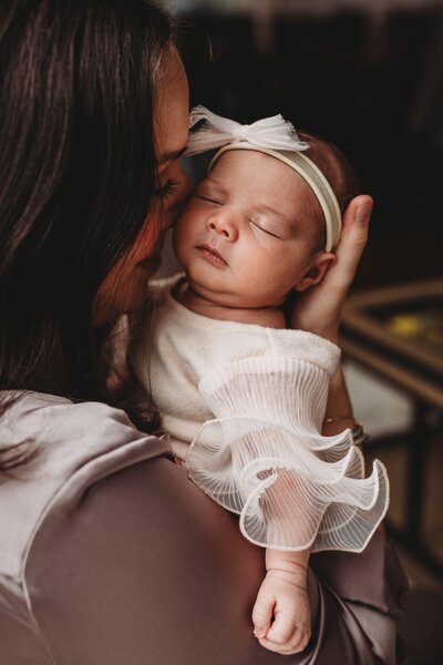 Capture the tenderness of your newborn's first days with a lifestyle newborn photography session in Connecticut. This intimate in-home session preserves the raw and genuine moments of new parenthood in a cozy, natural setting.