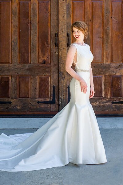 Link to more details and photos of the Eva wedding dress style. Its a mikado fit-and-flare silhouette with an old Hollywood glamour vibe.