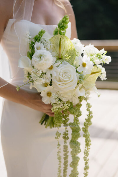 A white real-flower wedding bouquet for a local carolinas bride.