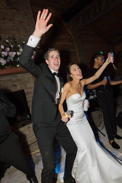 Bride and groom dance at their wedding reception with the band