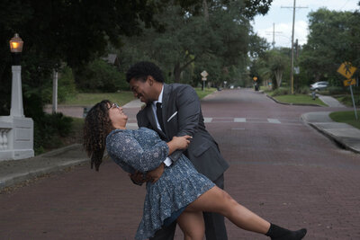 Sean and Graciela posing in the street in dressy attire