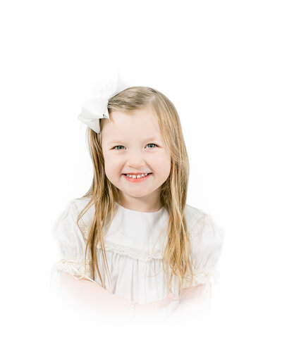 A classic heirloom children's portrait featuring a young toddler with golden hair and bright blue eyes, dressed in a traditional light blue outfit. Timeless children's photography with a soft, painterly background.