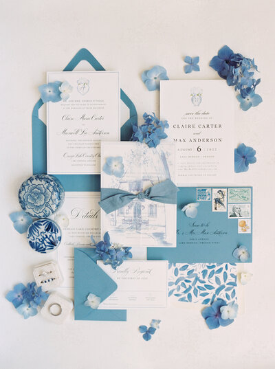 blue and white wedding invitation flat lay  with hydrangeas