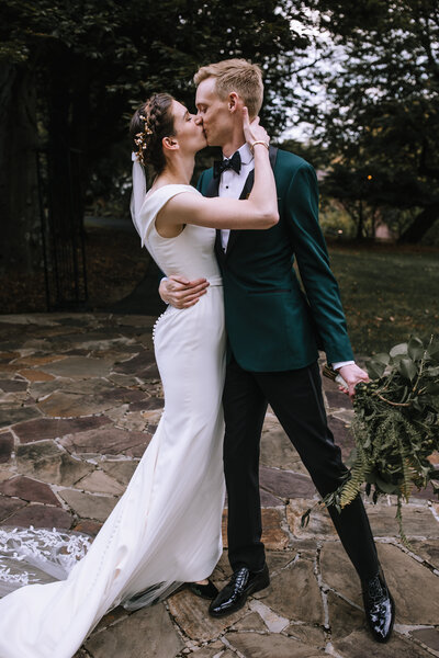 Bride and groom kissing at their wedding at the Springwood Conference Center. 