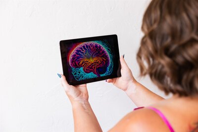 A picture of a neon bran on an iPad