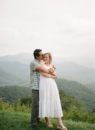 Blue ridge parkway engagement couple hugging