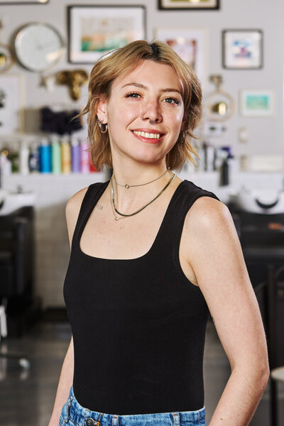 Headshot of Epoch Studio Salon's associate hair stylist, Angy