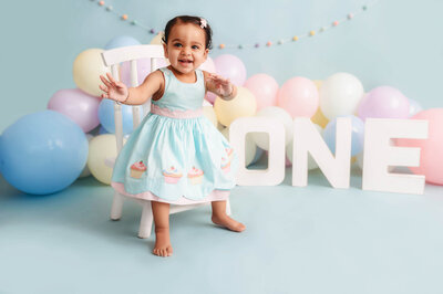 Toddler poses for Cake Smash Photoshoot in Charleston, SC