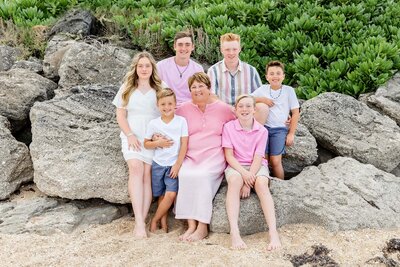 Extended family portrait sitting on rocks