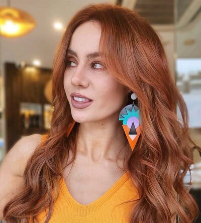 Rich copper-red wavy hair with vibrant shine, highlighting expert application of Great Lengths hair extensions in Cronulla.