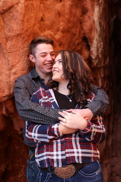 Couple shares warm embrace in Garden of the Gods park