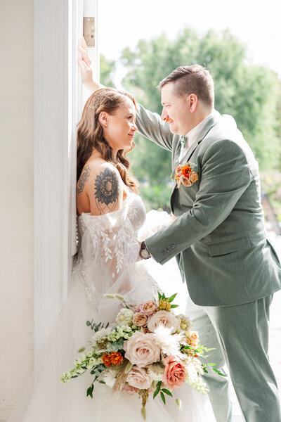 bride and groom in a doorway