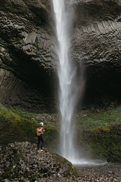The owner of Katharina Luise Photo is looking at a waterfall. 