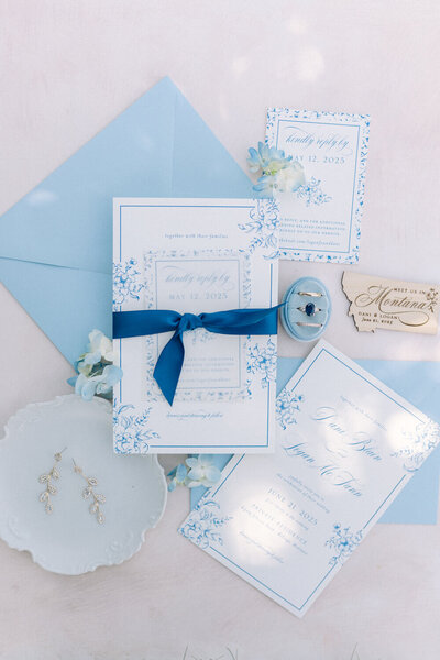 Blue and white wedding invitations with custom wood magnet.