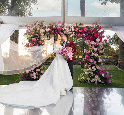 Lush pink floral wedding ceremony arch. Luxury wedding flowers in Huntsville, AL.