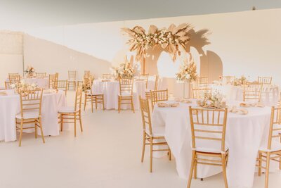 Reception Tables with Ceremony Backdrop - Bre & Chris | Converted Basketball Court Wedding – Featured in Brides Magazine