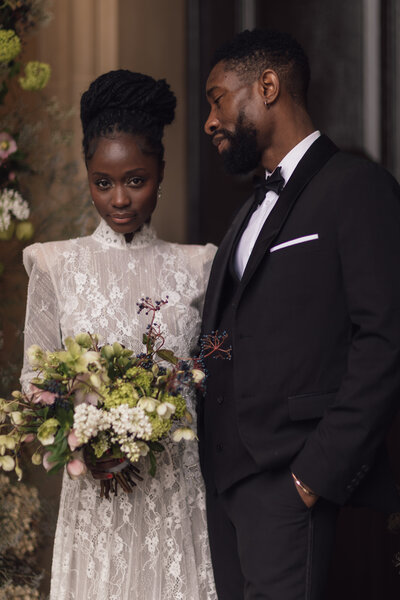 Wedding photographer captures couple taking a stroll hand in hand at their french chateau wedding.