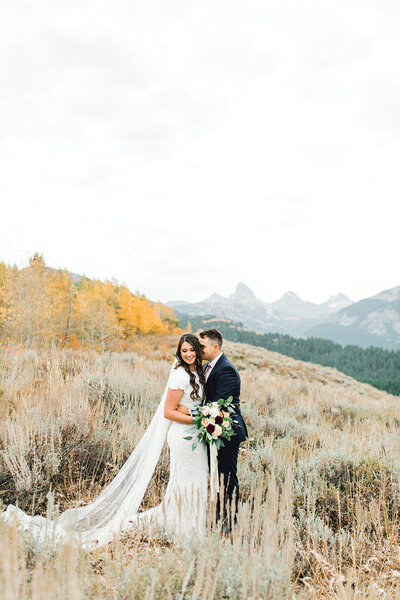 Couple on Ski Hill Road in Alta Wyoming in Wedding Clothing