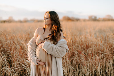 pregnant woman in a corn field