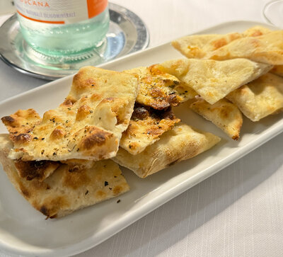 Focaccia at bread service in Viareggio, Italy.