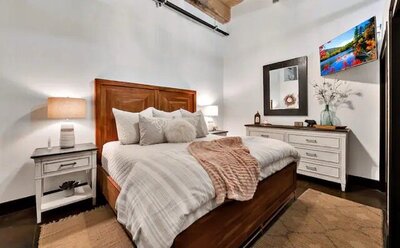 Bedroom  in this 3-bedroom, 2-bathroom luxury condo in downtown Waco, TX