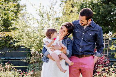 portrait picture of a family with the parents and their daughter