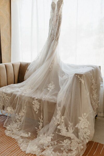 Wedding Gown Hanging in a Window - Megan & Amber | Hood River Wedding  - LGBTQ Wedding