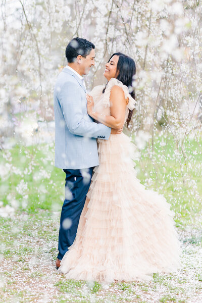 couple  anniversary posing at cherry blossom