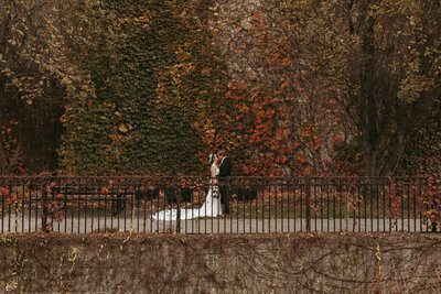 Bride and groom celebrating their wedding during the fall season in Michigan