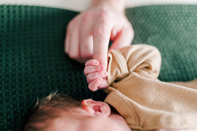 Newborn Baby Holding Dads Finger