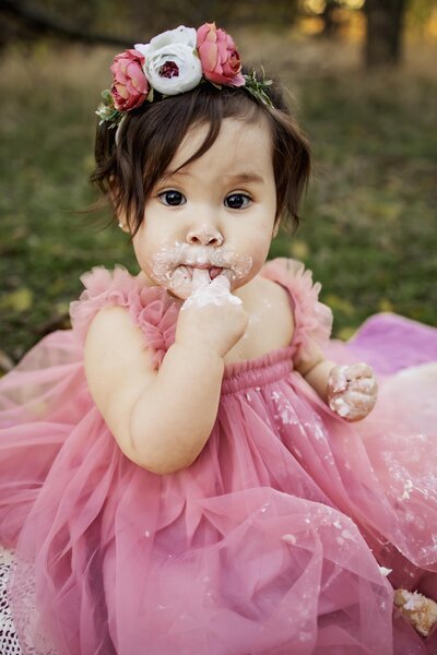 family of three at a cake smash session