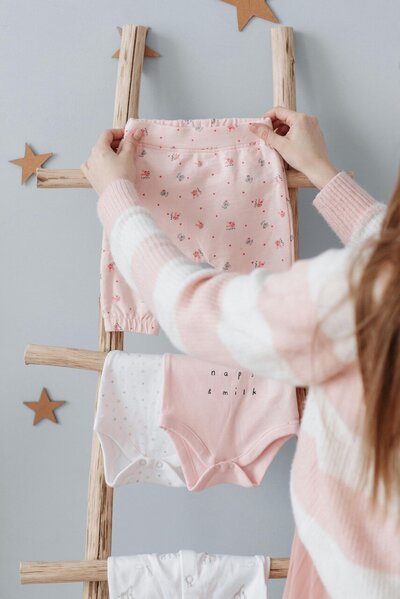 Mom with baby clothes