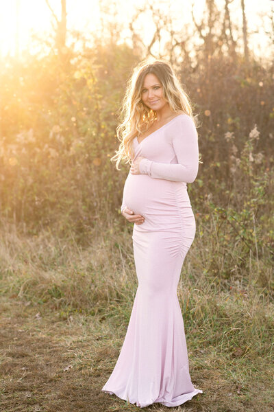 mom to be in pink maternity dress