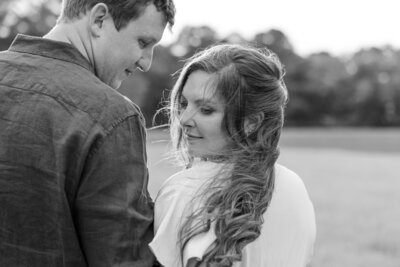 Wind blowing bride's hair, couple walking