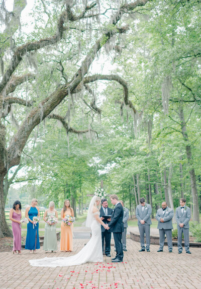 Bride and groom kiss at Old Homestead Farm in NC.