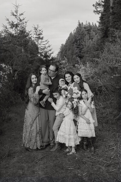 Family laughing and playing during a fun outdoor photo session in LosAngeles